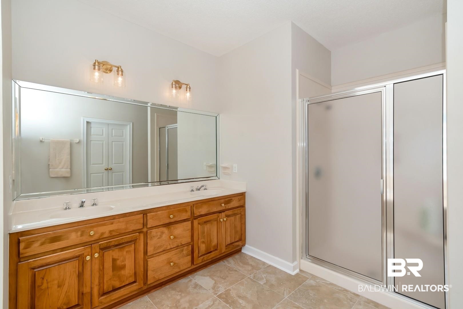 6090 Celeste Road Saraland, AL 36571 - Photo 20 of 38 Full bathroom with a shower stall, double vanity, and a sink