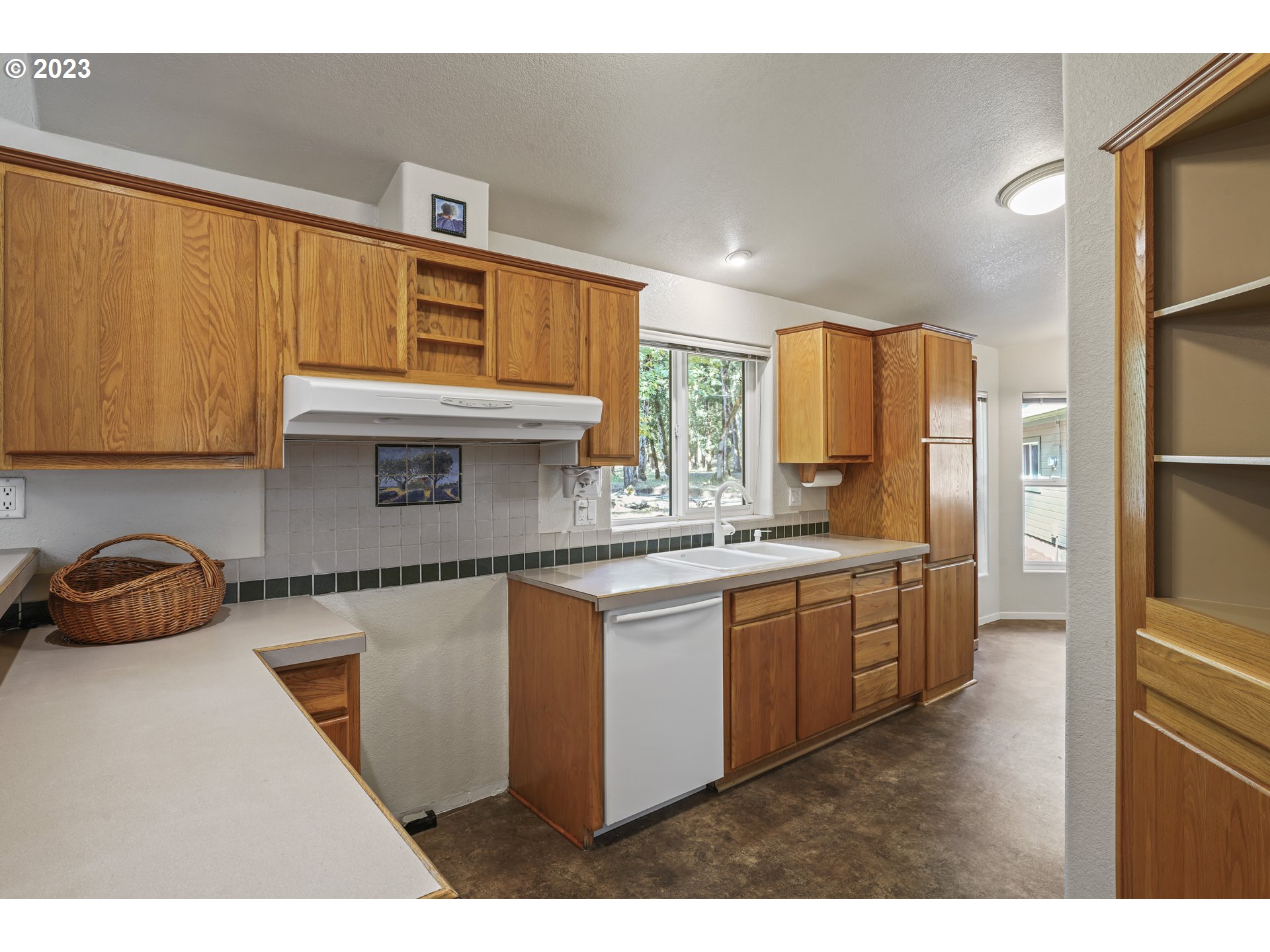 31861 Owl Road Eugene, OR 97405 - Photo 13 of 38 a kitchen with stainless steel appliances granite countertop a sink refrigerator and cabinets