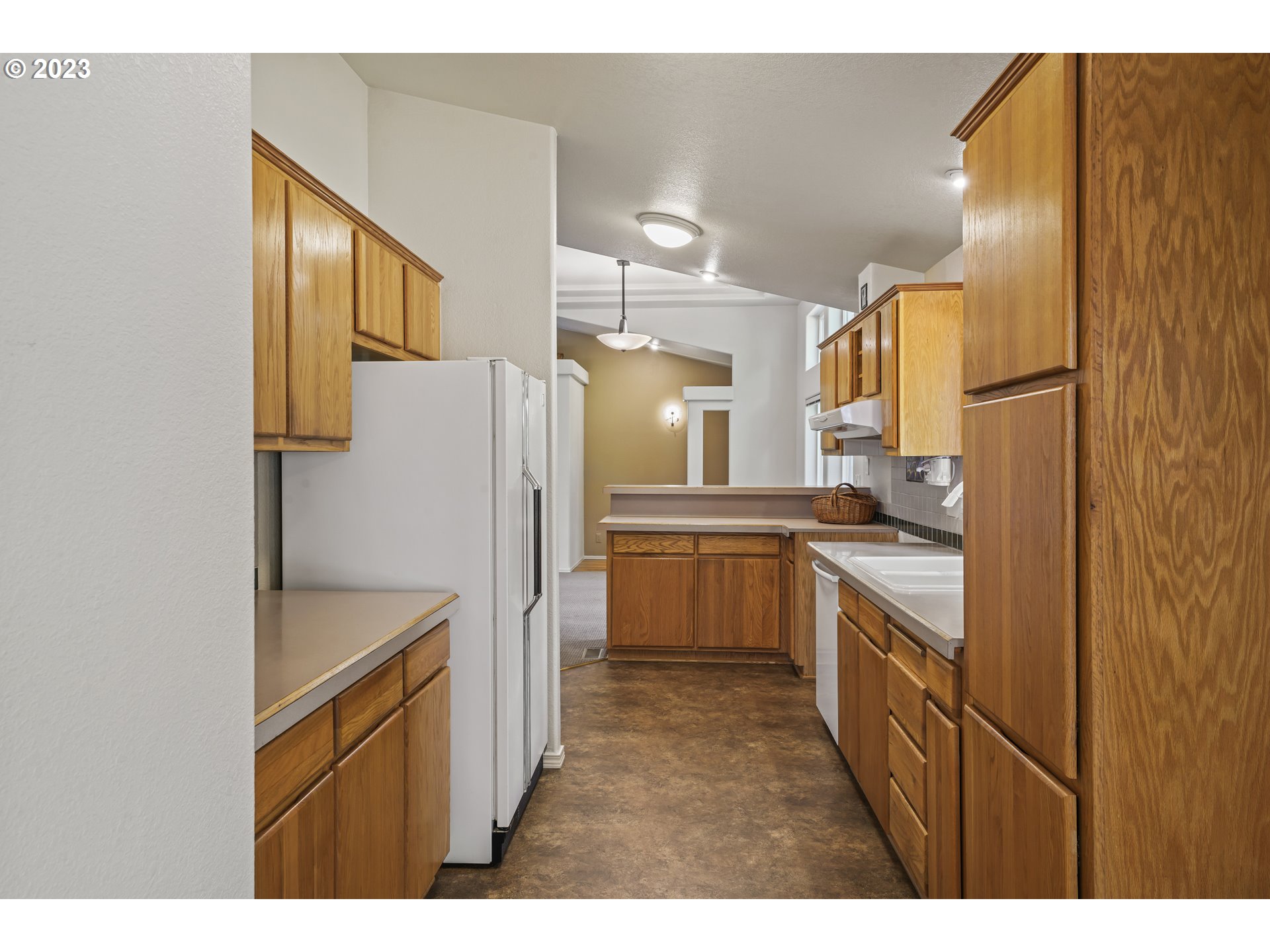 31861 Owl Road Eugene, OR 97405 - Photo 15 of 38 a kitchen with a refrigerator sink and cabinets