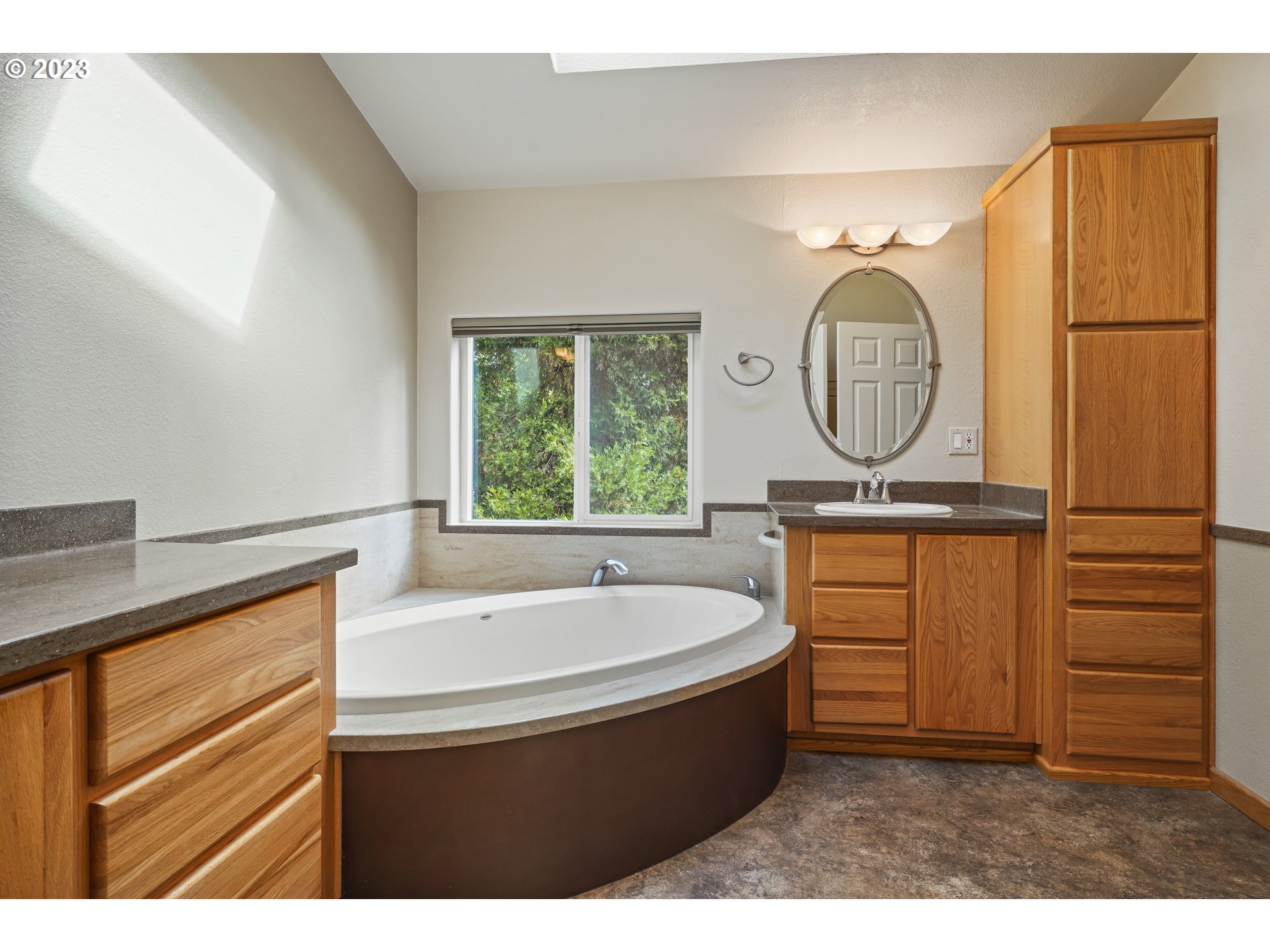 31861 Owl Road Eugene, OR 97405 - Photo 20 of 38 a bathroom with a sink mirror vanity and a bathtub