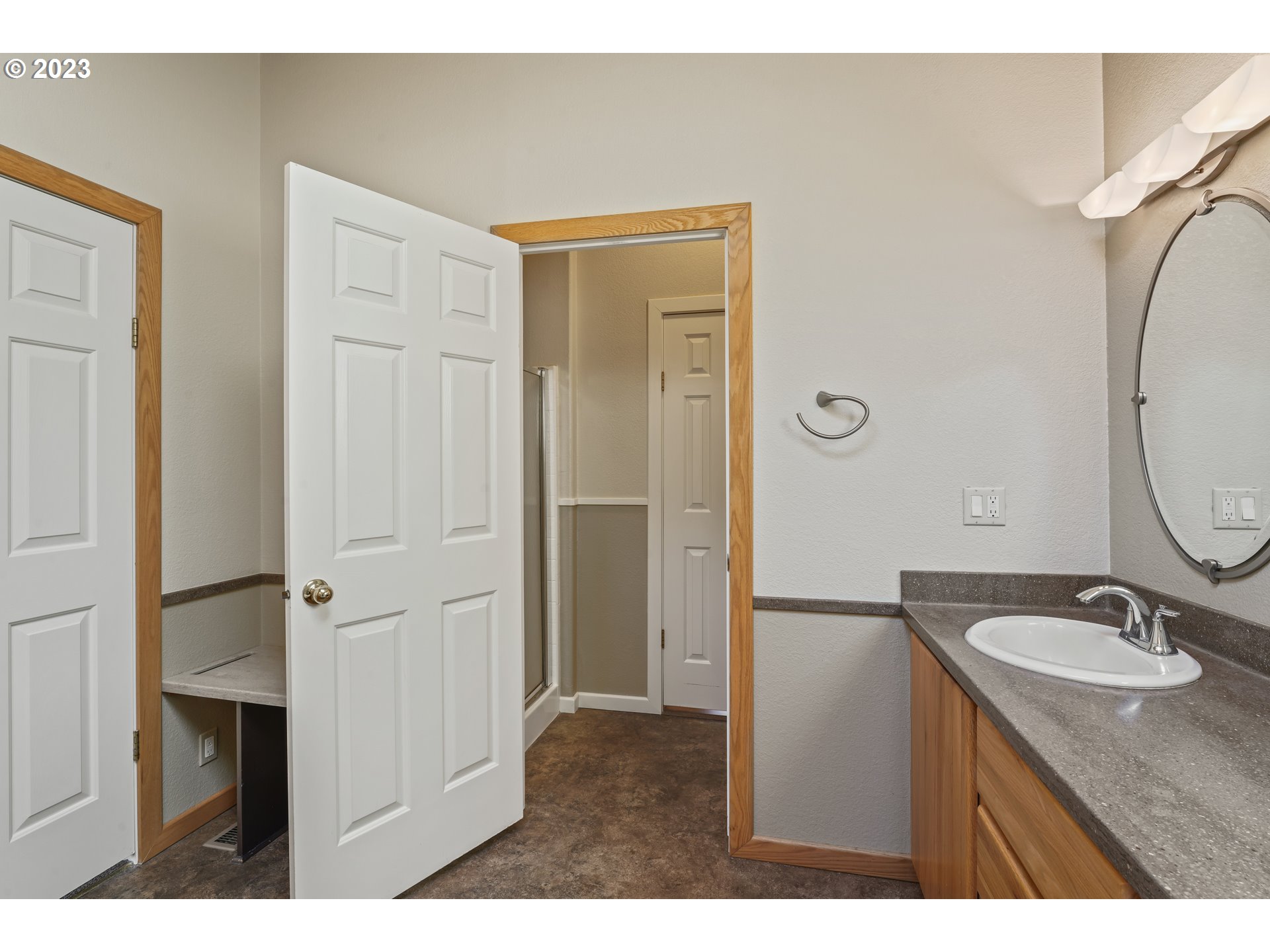 31861 Owl Road Eugene, OR 97405 - Photo 23 of 38 a bathroom with a granite countertop sink shower and a mirror