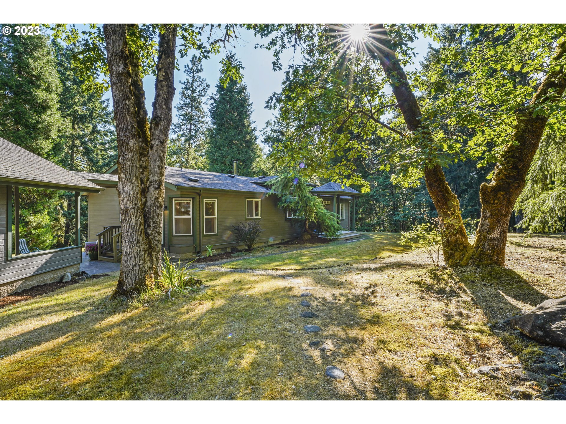 31861 Owl Road Eugene, OR 97405 - Photo 4 of 38 a view of a house with backyard and a tree