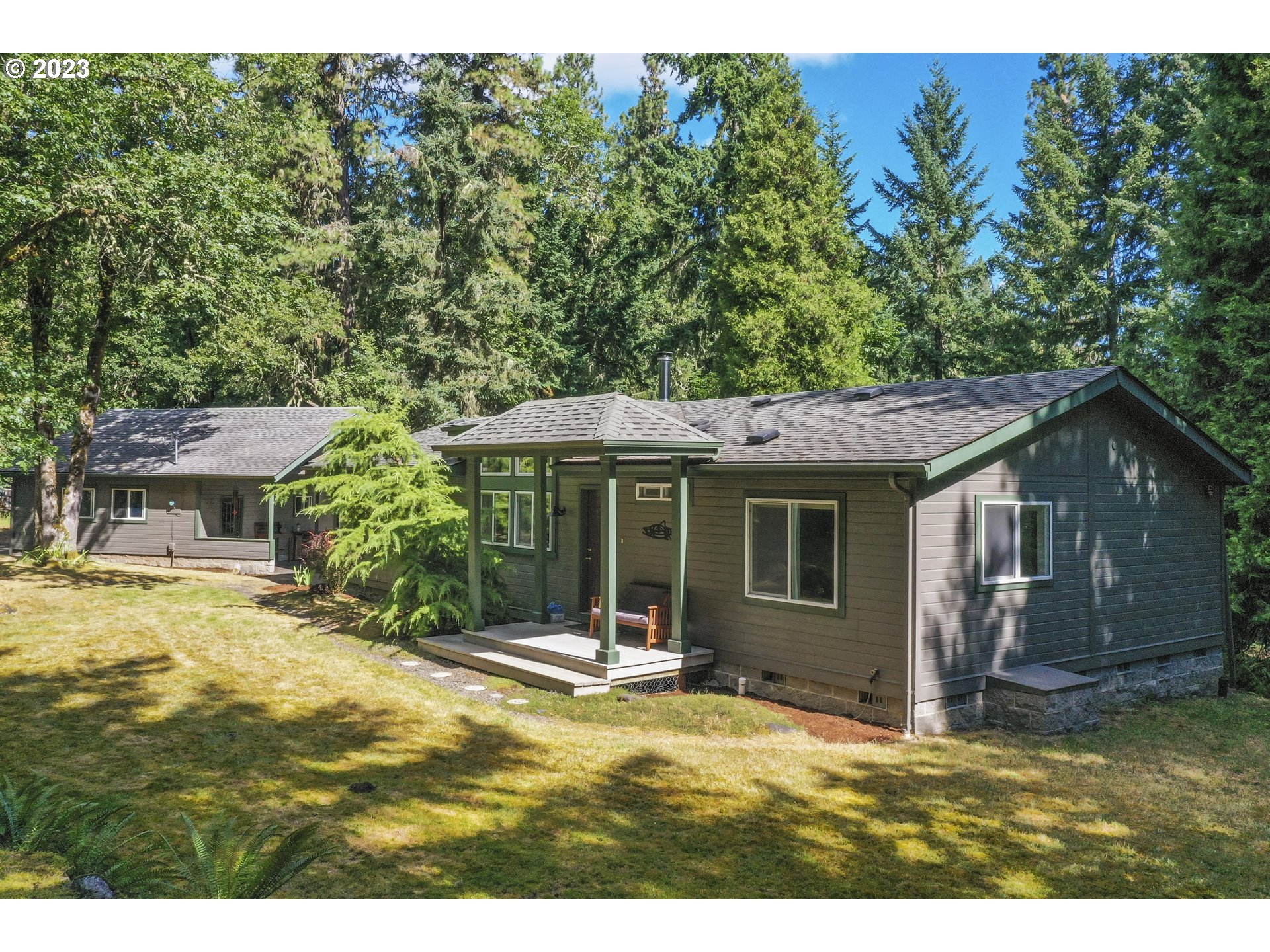 31861 Owl Road Eugene, OR 97405 - Photo 5 of 38 a view of a house with backyard and a tree