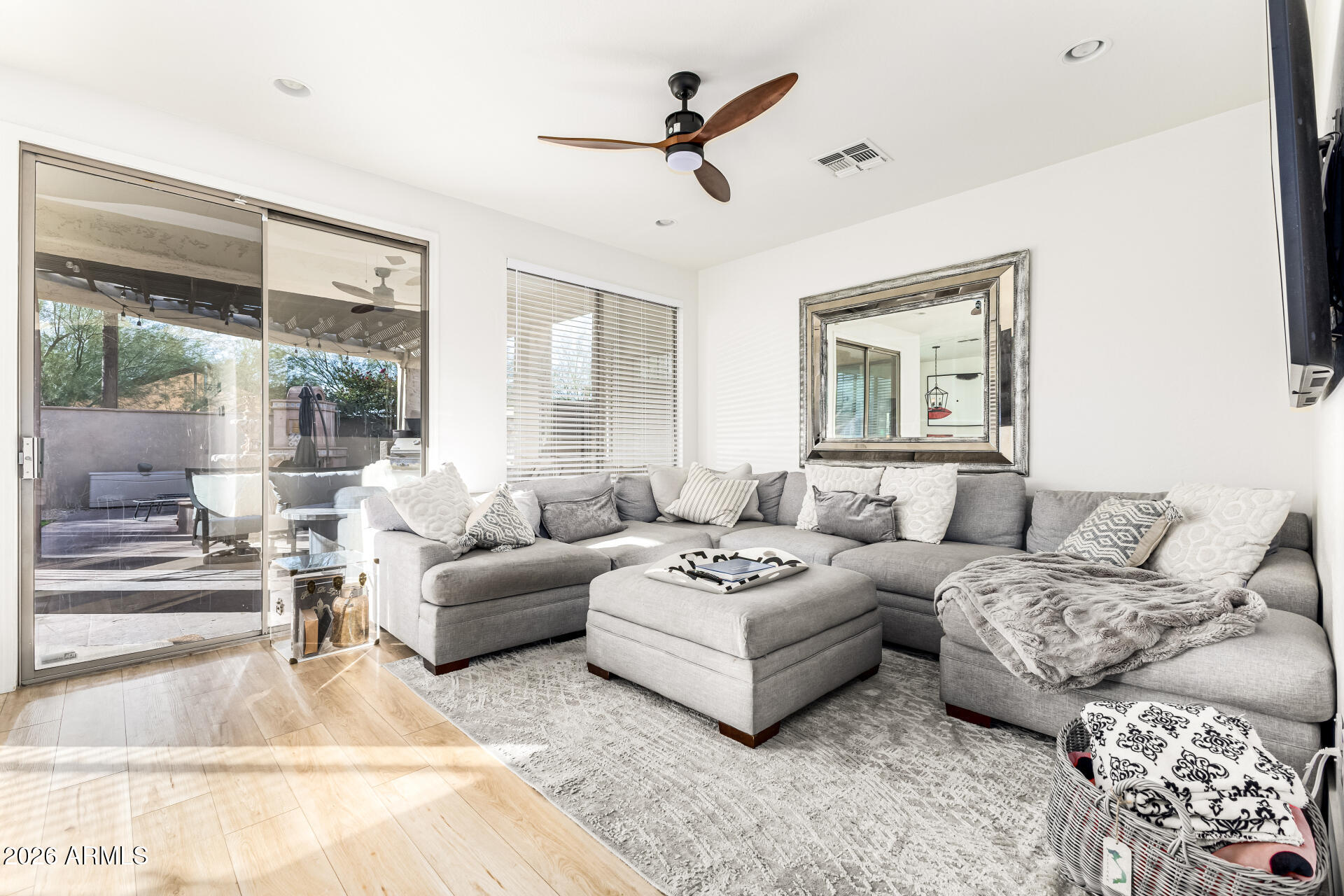 2707 West Lamar Road Phoenix, AZ 85017 - Photo 11 of 50 a living room with furniture a large window and a chandelier