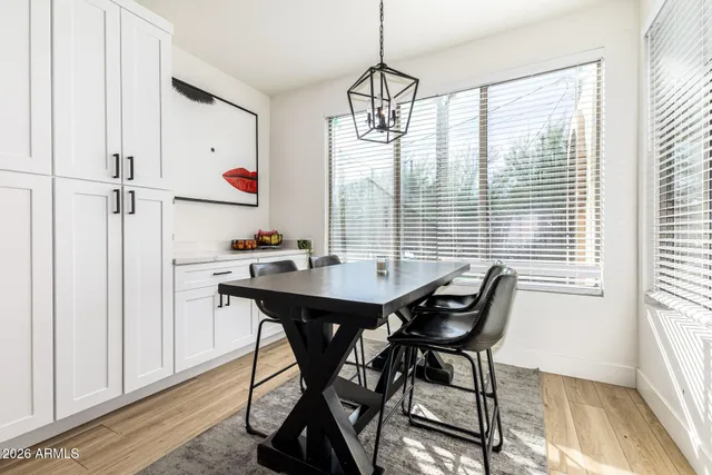 a view of a dining room with furniture window and outside view
