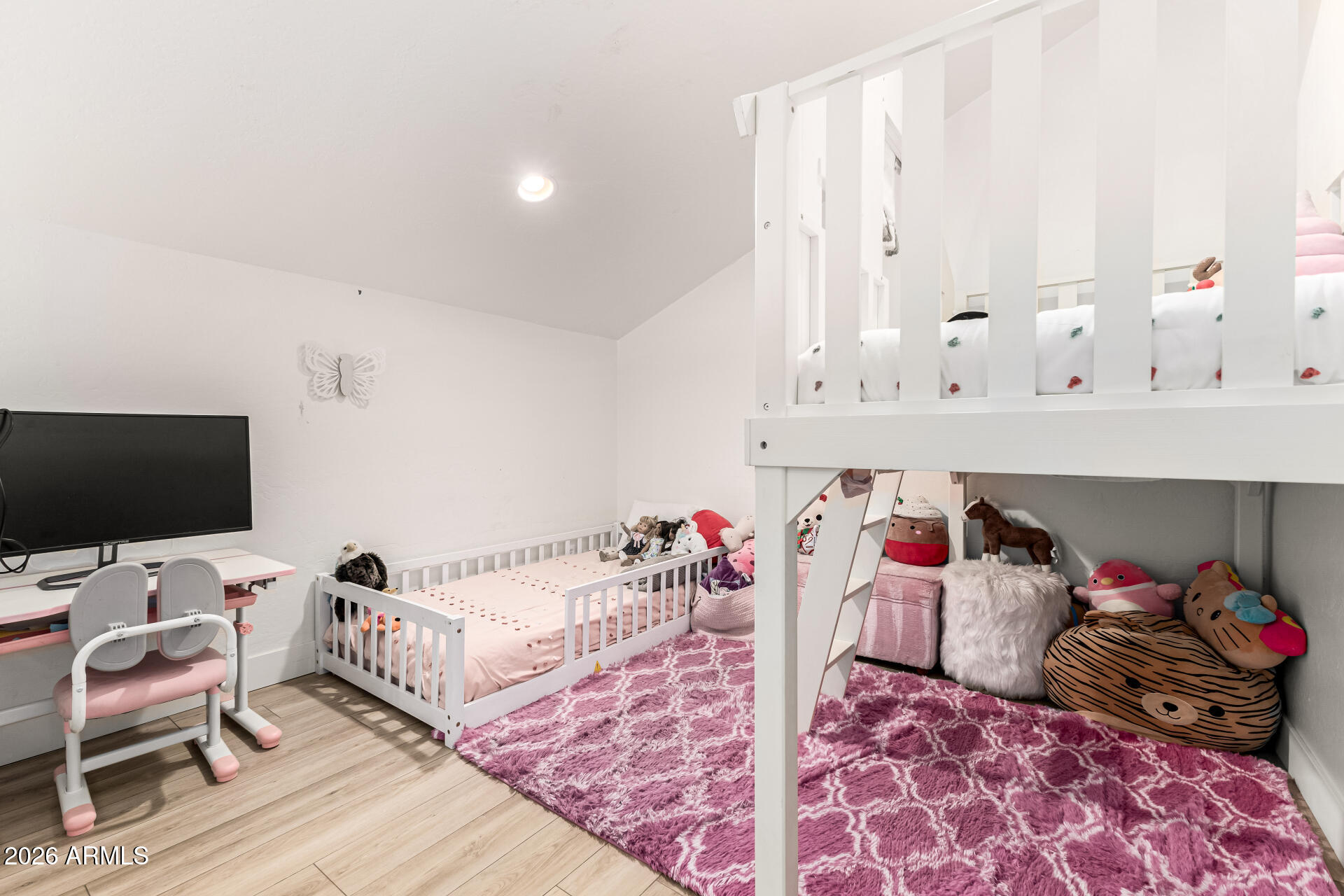 2707 West Lamar Road Phoenix, AZ 85017 - Photo 19 of 50 a bed room with a bed and a chair