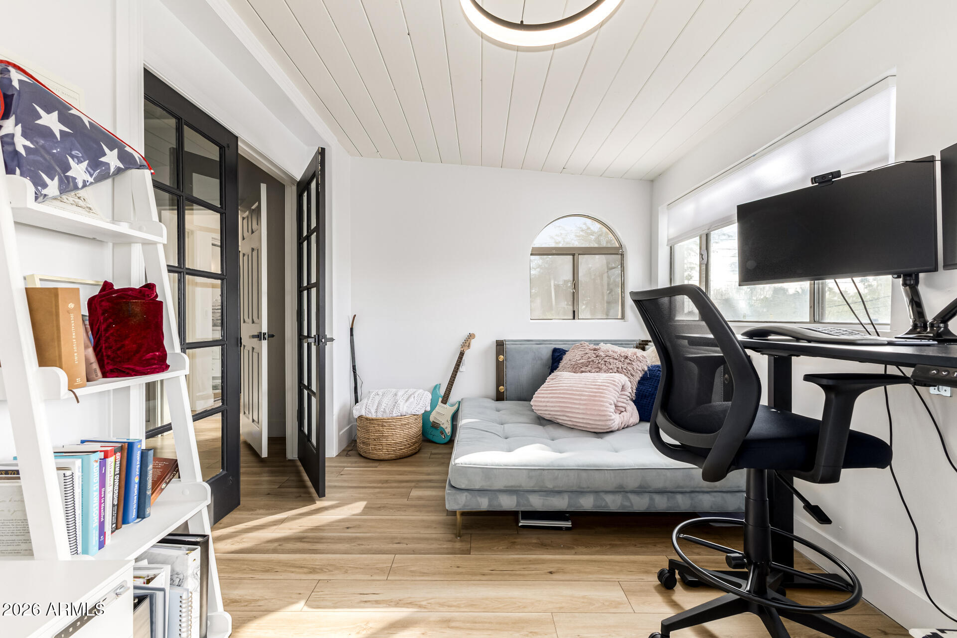 2707 West Lamar Road Phoenix, AZ 85017 - Photo 24 of 50 a living room with furniture and a flat screen tv