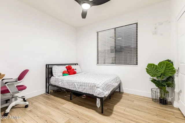 a room with a bed and a chandelier