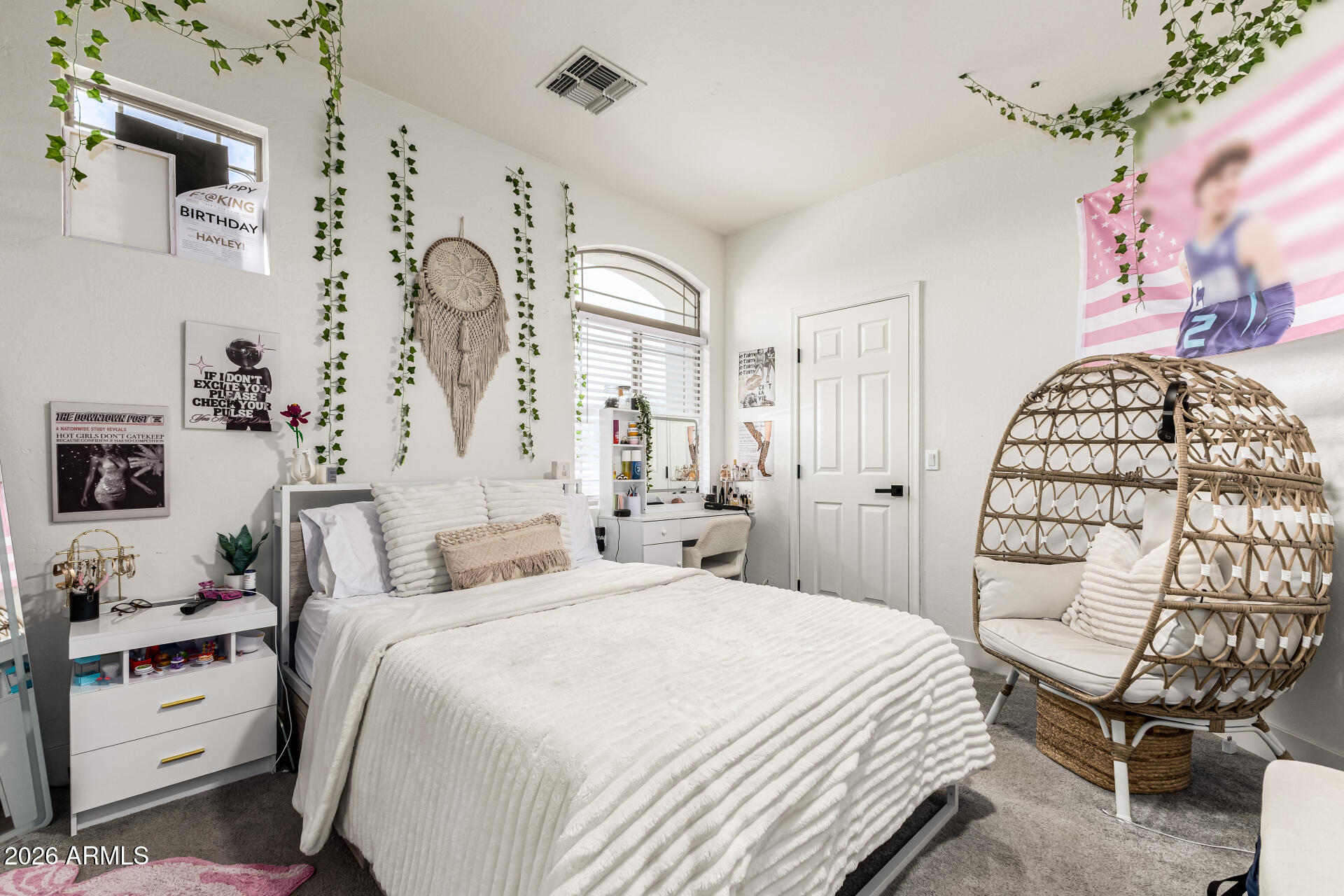 2707 West Lamar Road Phoenix, AZ 85017 - Photo 30 of 50 a bedroom with a large bed and a chair