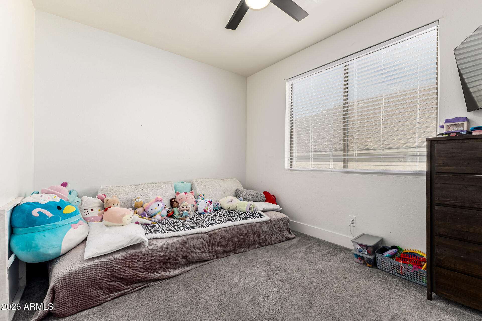 2707 West Lamar Road Phoenix, AZ 85017 - Photo 32 of 50 a bed room with furniture and a window