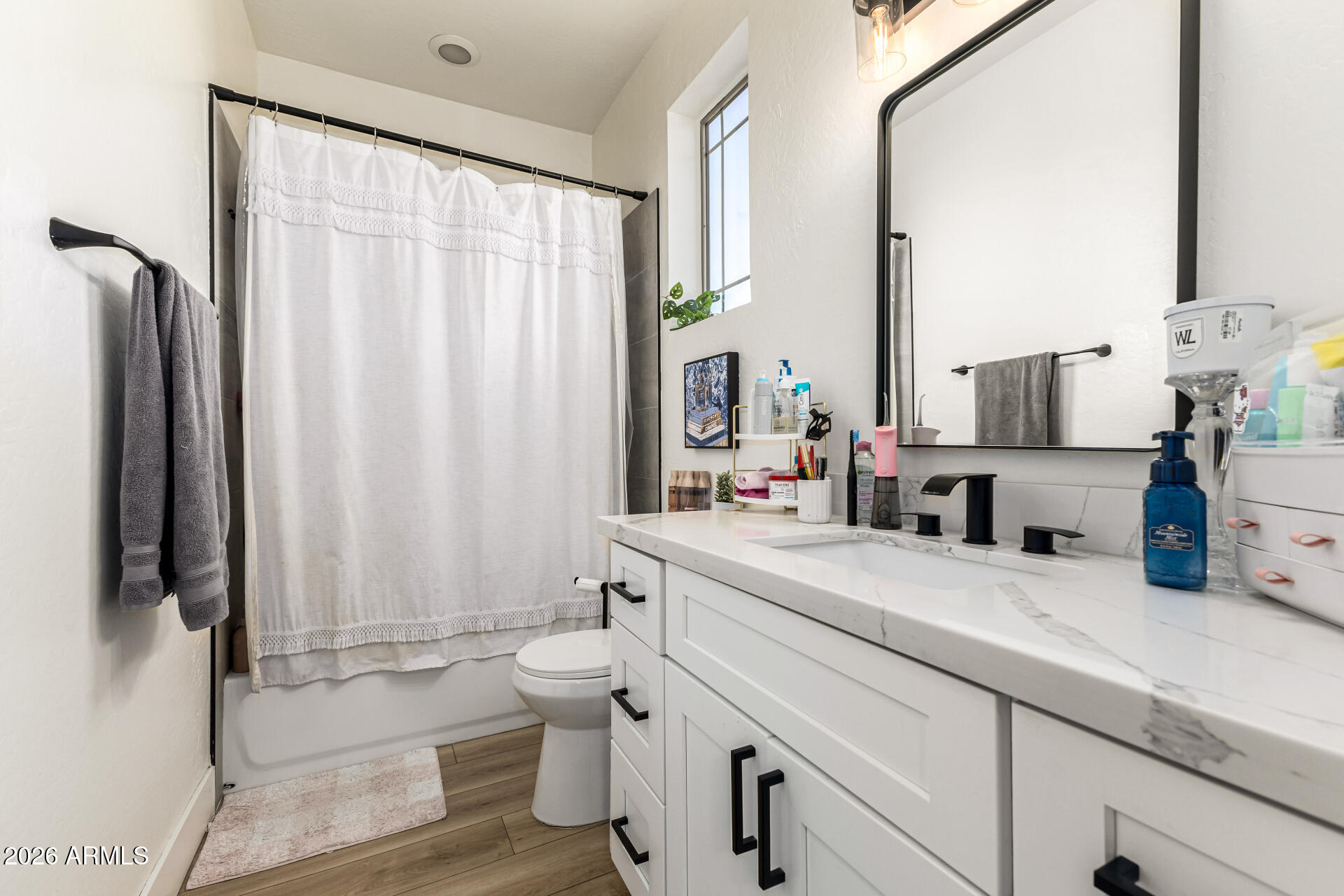 2707 West Lamar Road Phoenix, AZ 85017 - Photo 34 of 50 a bathroom with a sink a toilet and a mirror