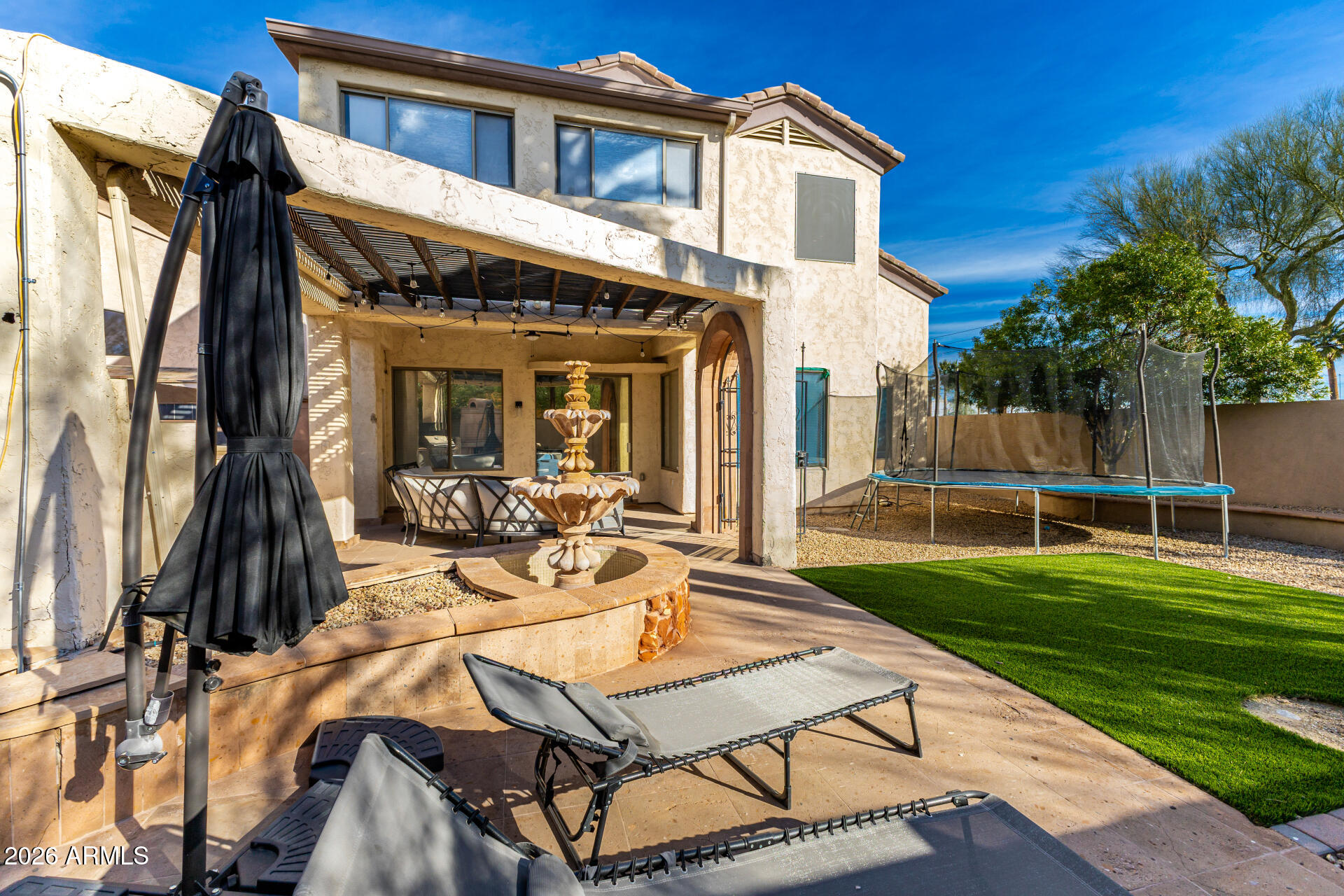 2707 West Lamar Road Phoenix, AZ 85017 - Photo 38 of 50 a view of a patio with table and chairs near a yard