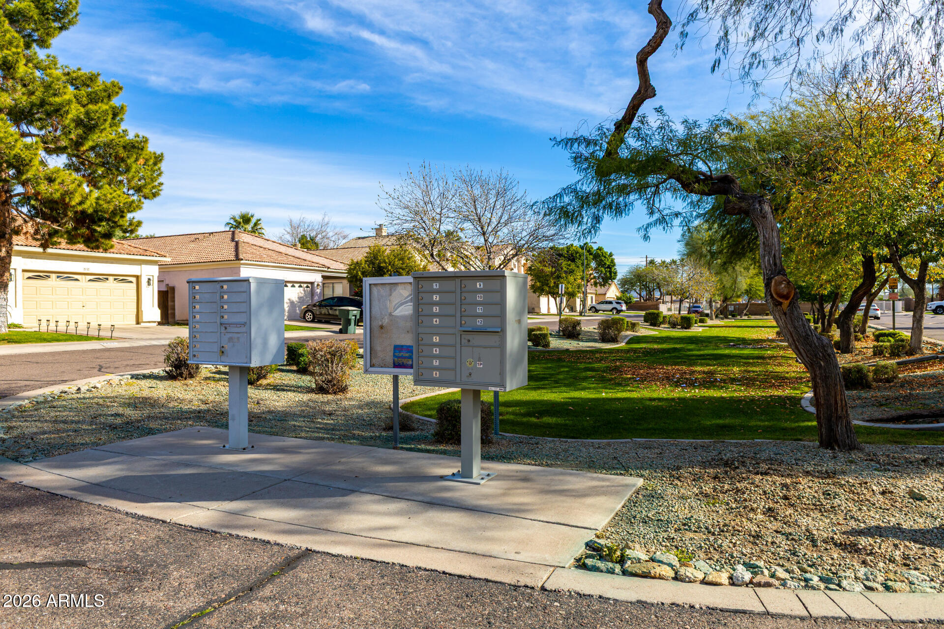 2707 West Lamar Road Phoenix, AZ 85017 - Photo 42 of 50 a front view of a house with a garden