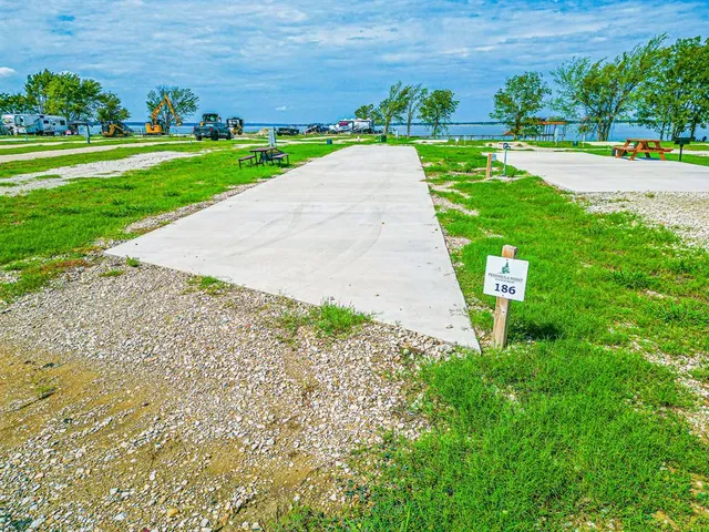 a view of a garden with a building in the background