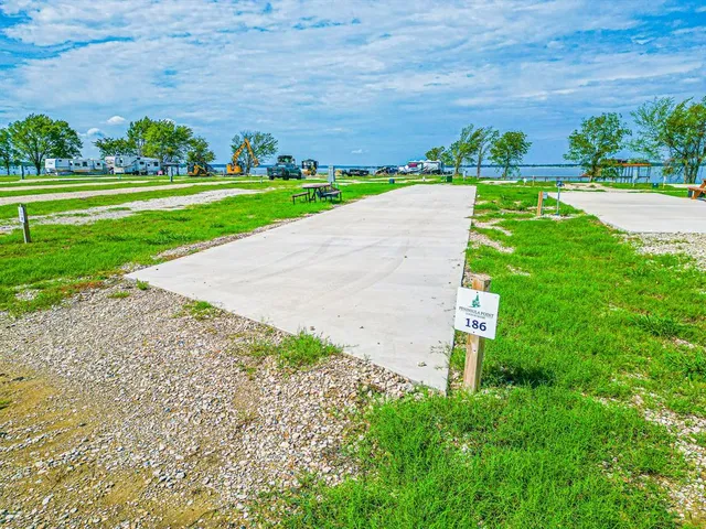 a view of a garden with a building in the background