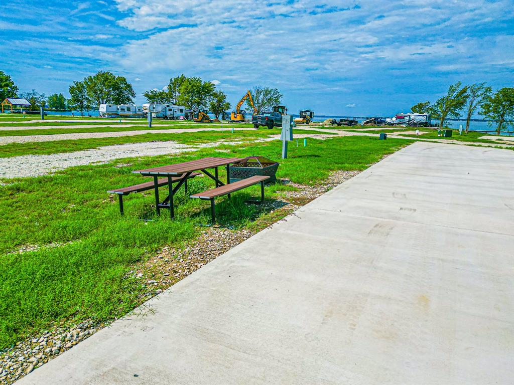 Lot 186 Peninsula Point Kerens, TX 75144 - Photo 14 of 28 a view of a park with large trees and a pathway
