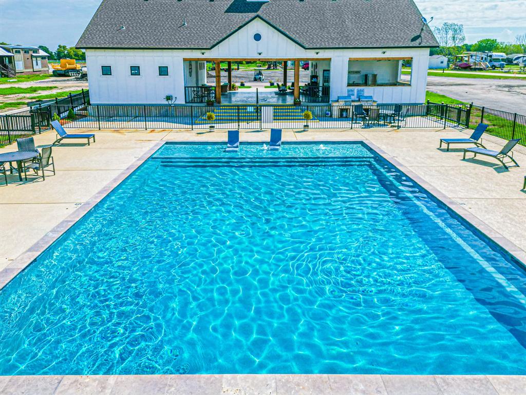 Lot 186 Peninsula Point Kerens, TX 75144 - Photo 18 of 28 a swimming pool view with a outdoor seating