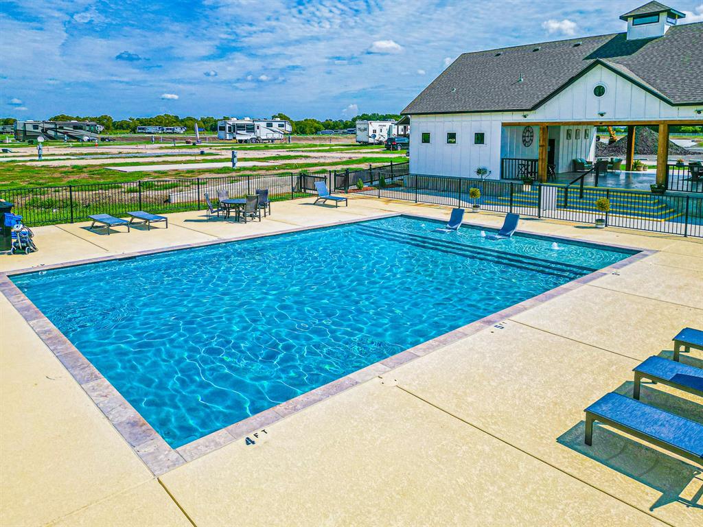 Lot 186 Peninsula Point Kerens, TX 75144 - Photo 20 of 28 a view of swimming pool with lawn chairs and plants