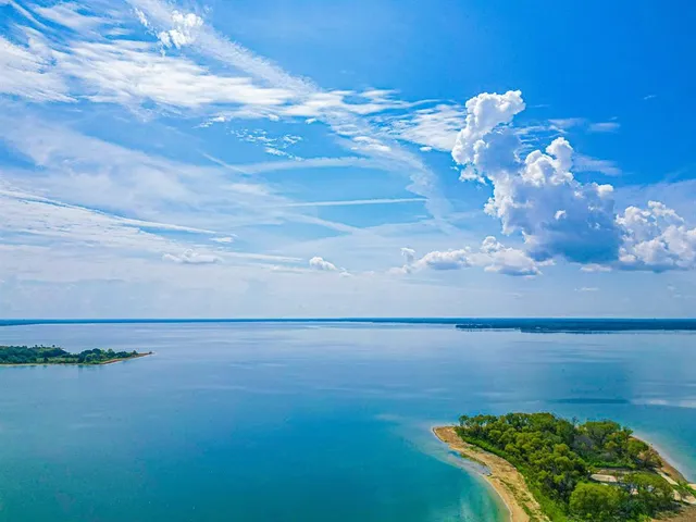 a view of a lake with a big yard