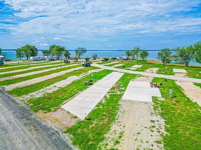a view of a big yard with potted plants and trees