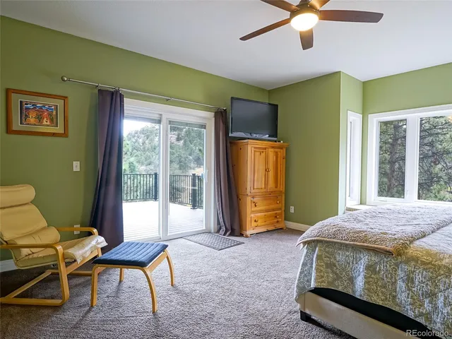 a bedroom with a bed and a chair