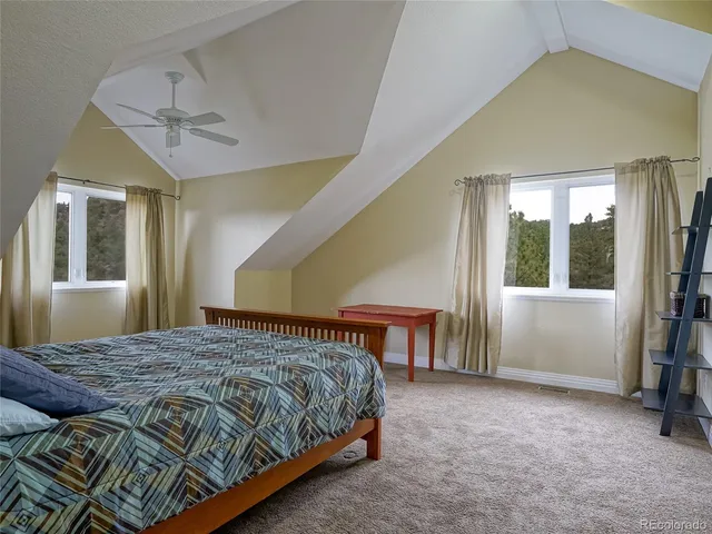 a bed sitting in a room next to a window