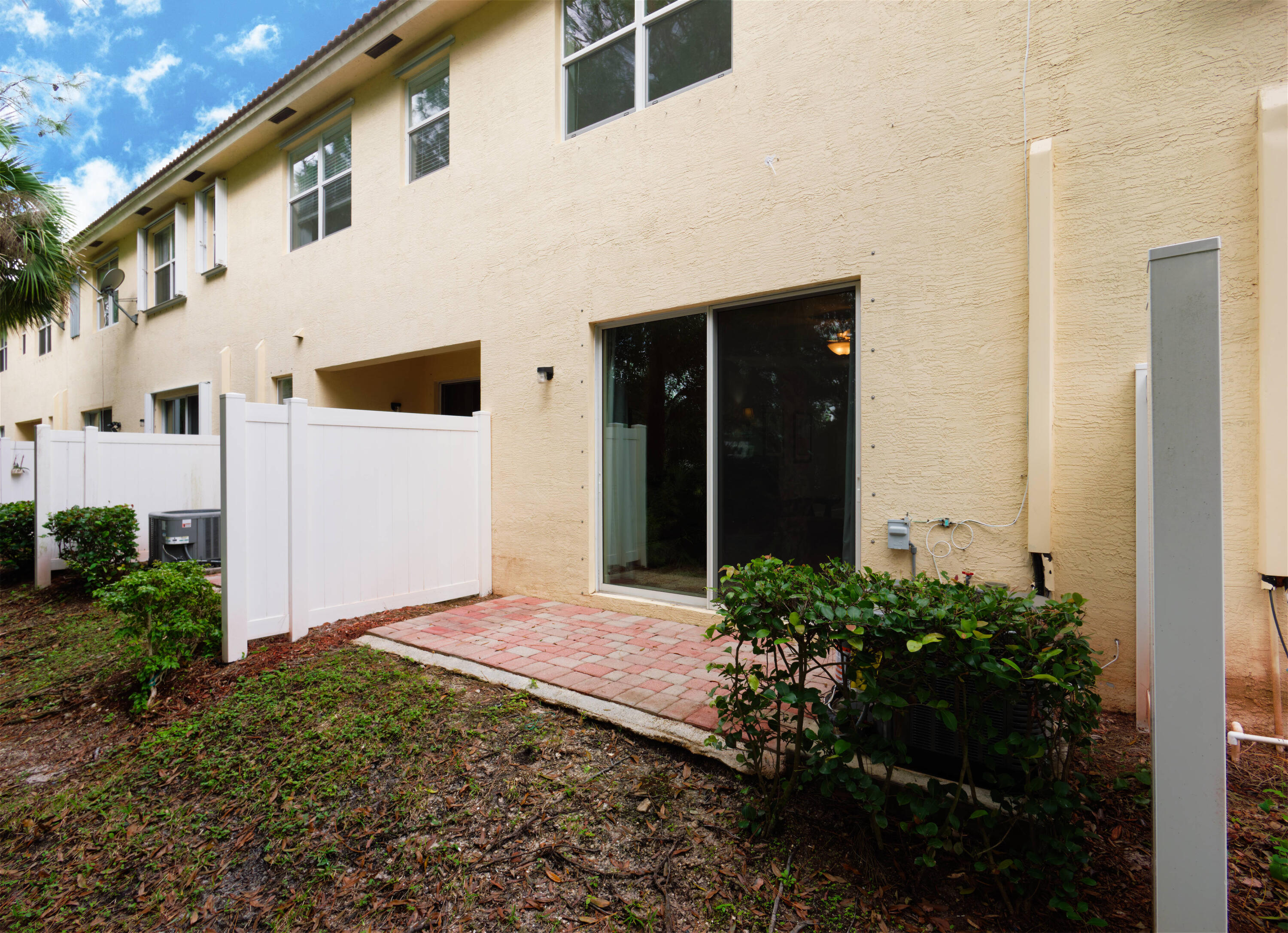 9674 Southwest Purple Martin Way Stuart, FL 34997 - Photo 13 of 21 a view of a house with backyard and garden