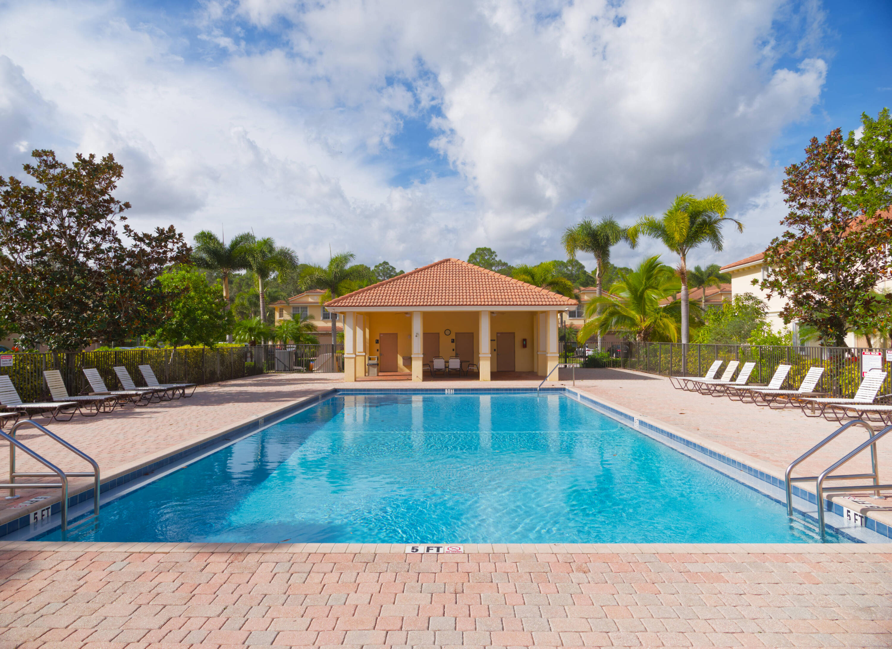 9674 Southwest Purple Martin Way Stuart, FL 34997 - Photo 19 of 21 a view of a house with swimming pool