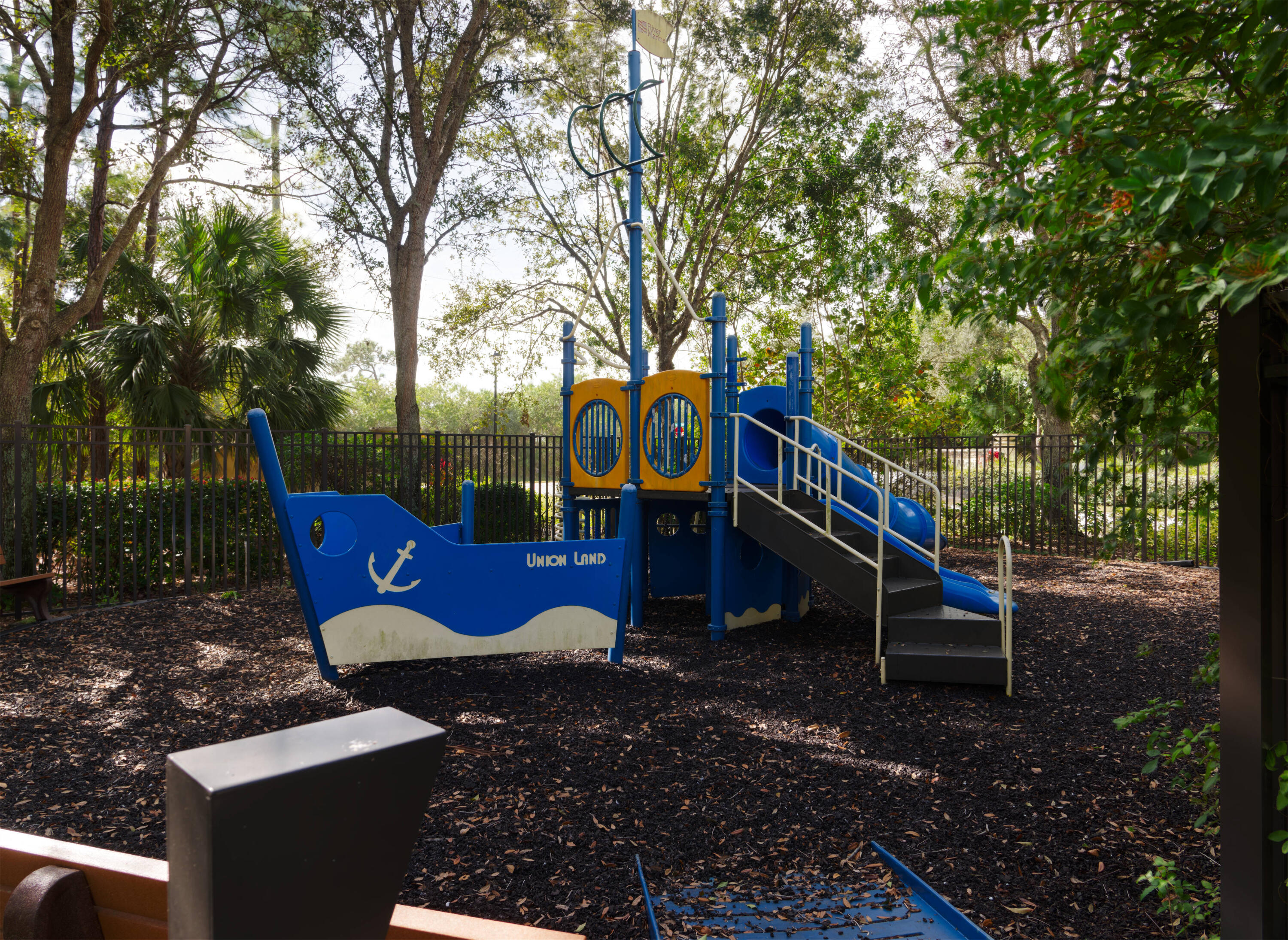 9674 Southwest Purple Martin Way Stuart, FL 34997 - Photo 20 of 21 a view of a park with iron fence
