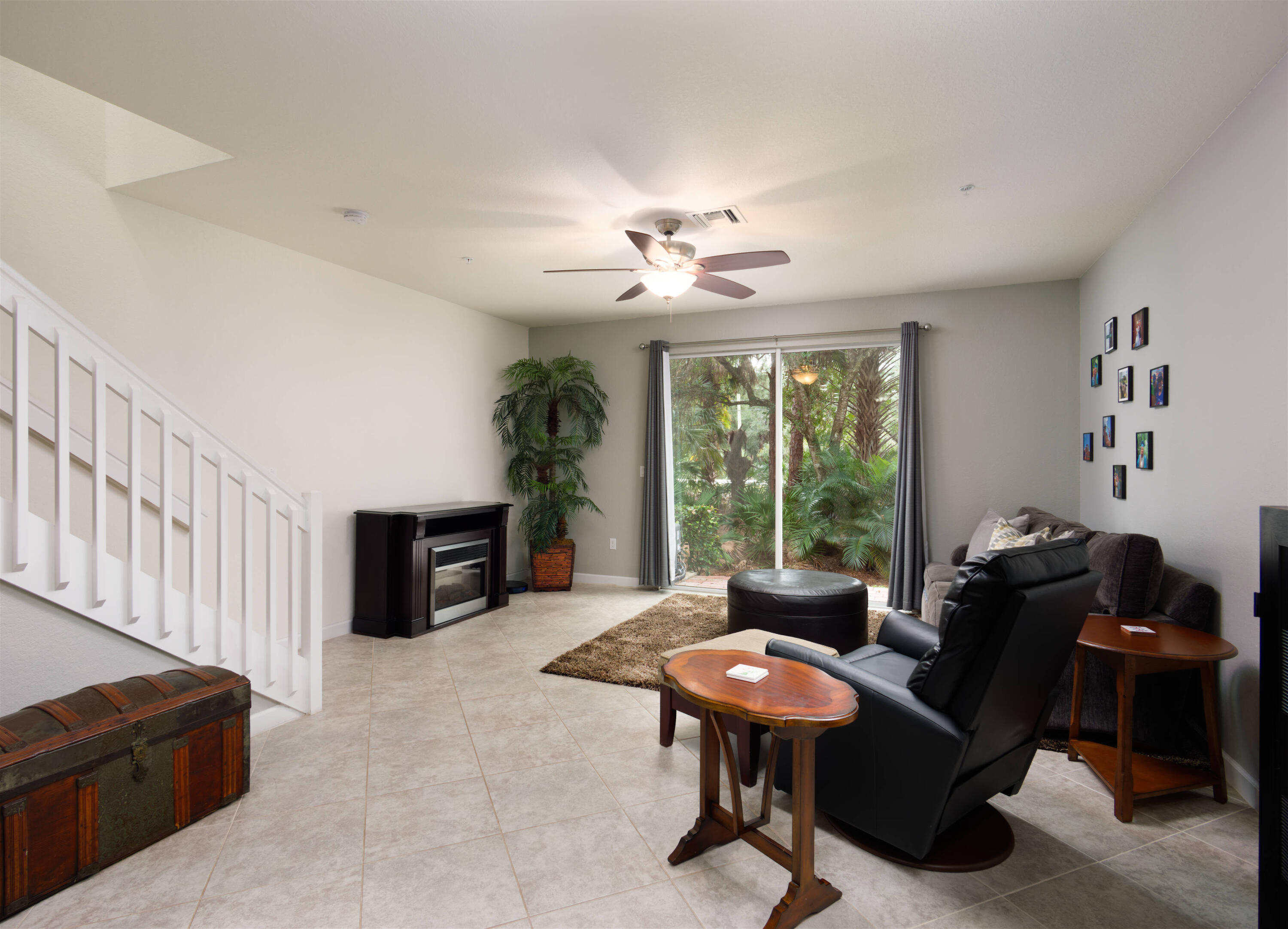 9674 Southwest Purple Martin Way Stuart, FL 34997 - Photo 5 of 21 a living room with furniture a table and a large window