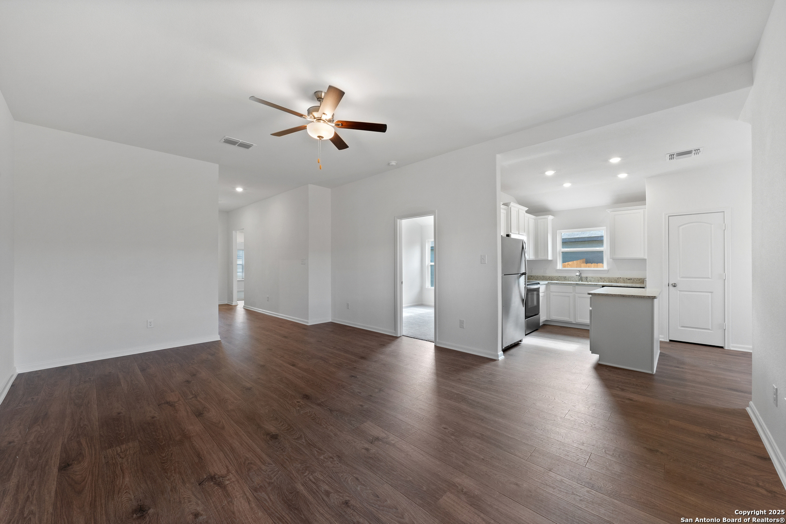 16024 Stratford Cove Lytle, TX 78052 - Photo 3 of 27 a view of an empty room and wooden floor