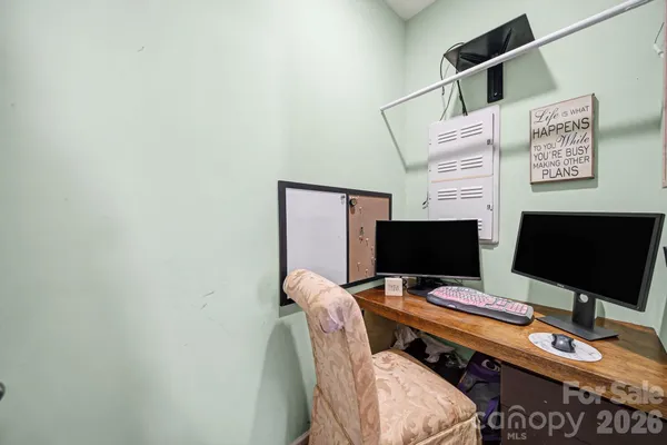 a view of a workspace with furniture