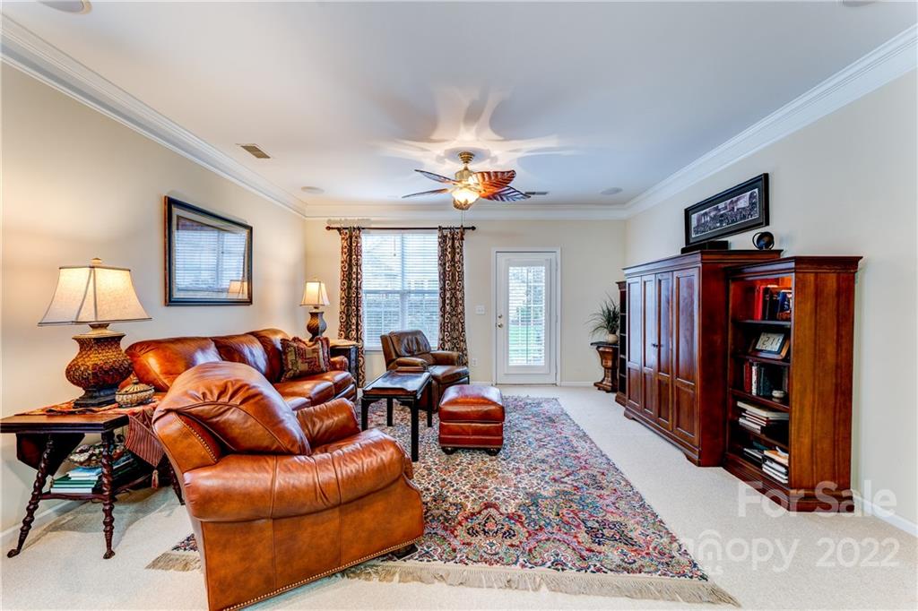 2336 Jade Lane Fort Mill, SC 29708 - Photo 16 of 41 a living room with furniture a bookshelf and a window