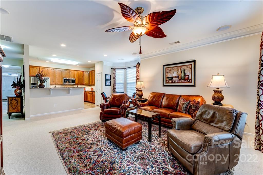 2336 Jade Lane Fort Mill, SC 29708 - Photo 17 of 41 a living room with furniture kitchen view and a chandelier