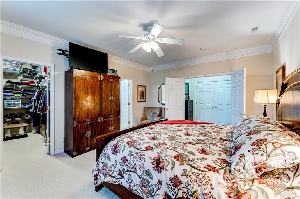 2336 Jade Lane Fort Mill, SC 29708 - Photo 20 of 41 a bedroom with a bed and a flat tv screen on the dresser