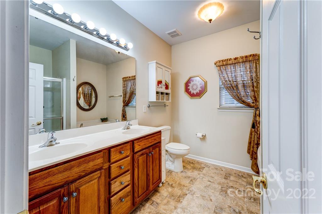 2336 Jade Lane Fort Mill, SC 29708 - Photo 22 of 41 a bathroom with a sink a toilet and a mirror
