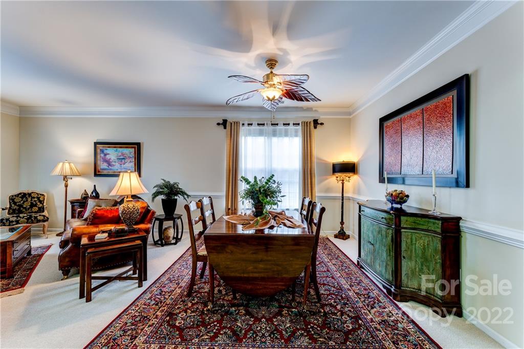2336 Jade Lane Fort Mill, SC 29708 - Photo 10 of 41 a living room with furniture a chandelier and a window