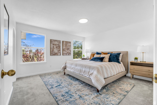 1147 West State Road Lehi, UT 84043 - Photo 17 of 31 Spacious bedroom featuring multiple windows, neutral tone walls, and soft gray carpeting