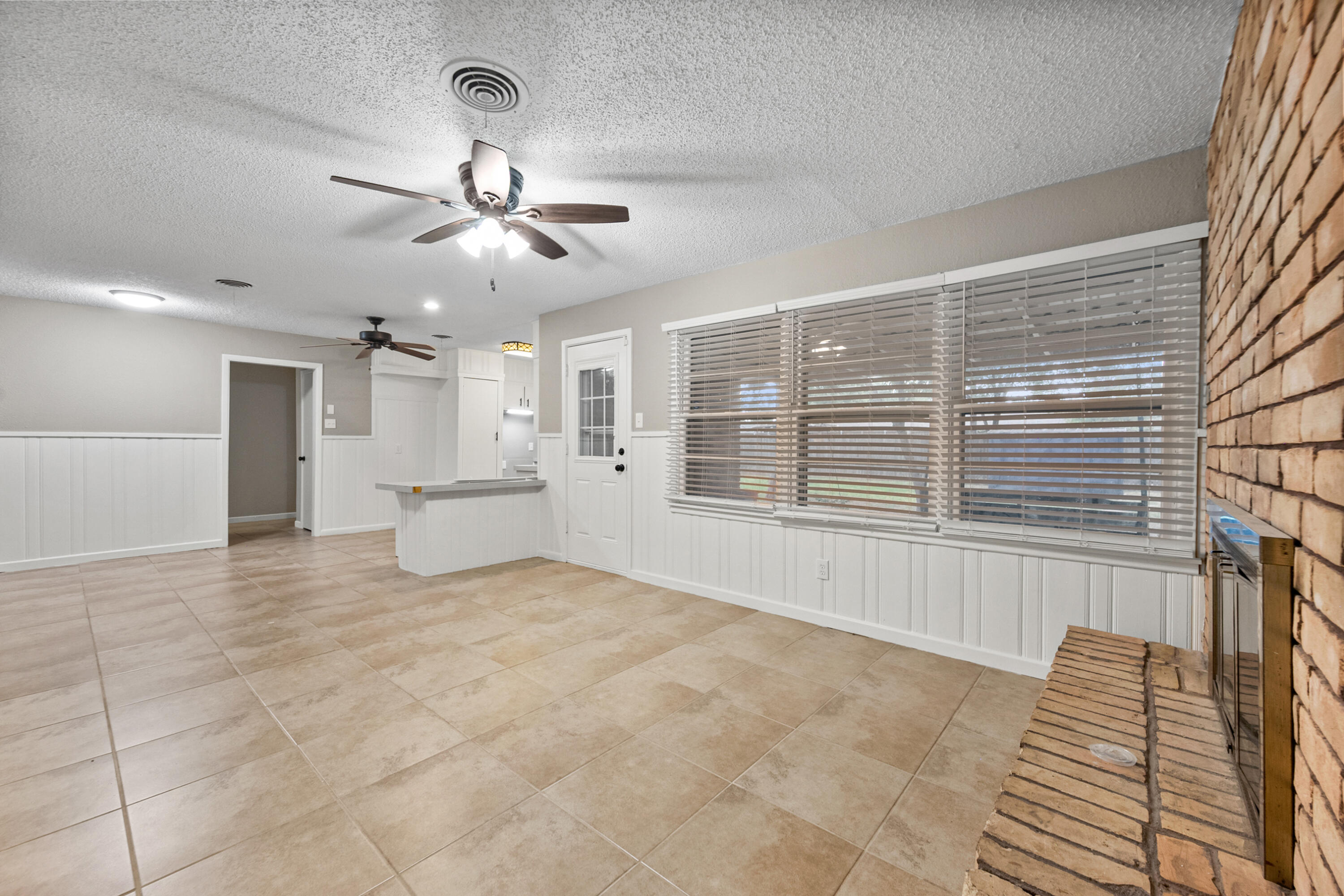 4915 11th Street Lubbock, TX 79416 - Photo 15 of 28 a view of an empty room with a window
