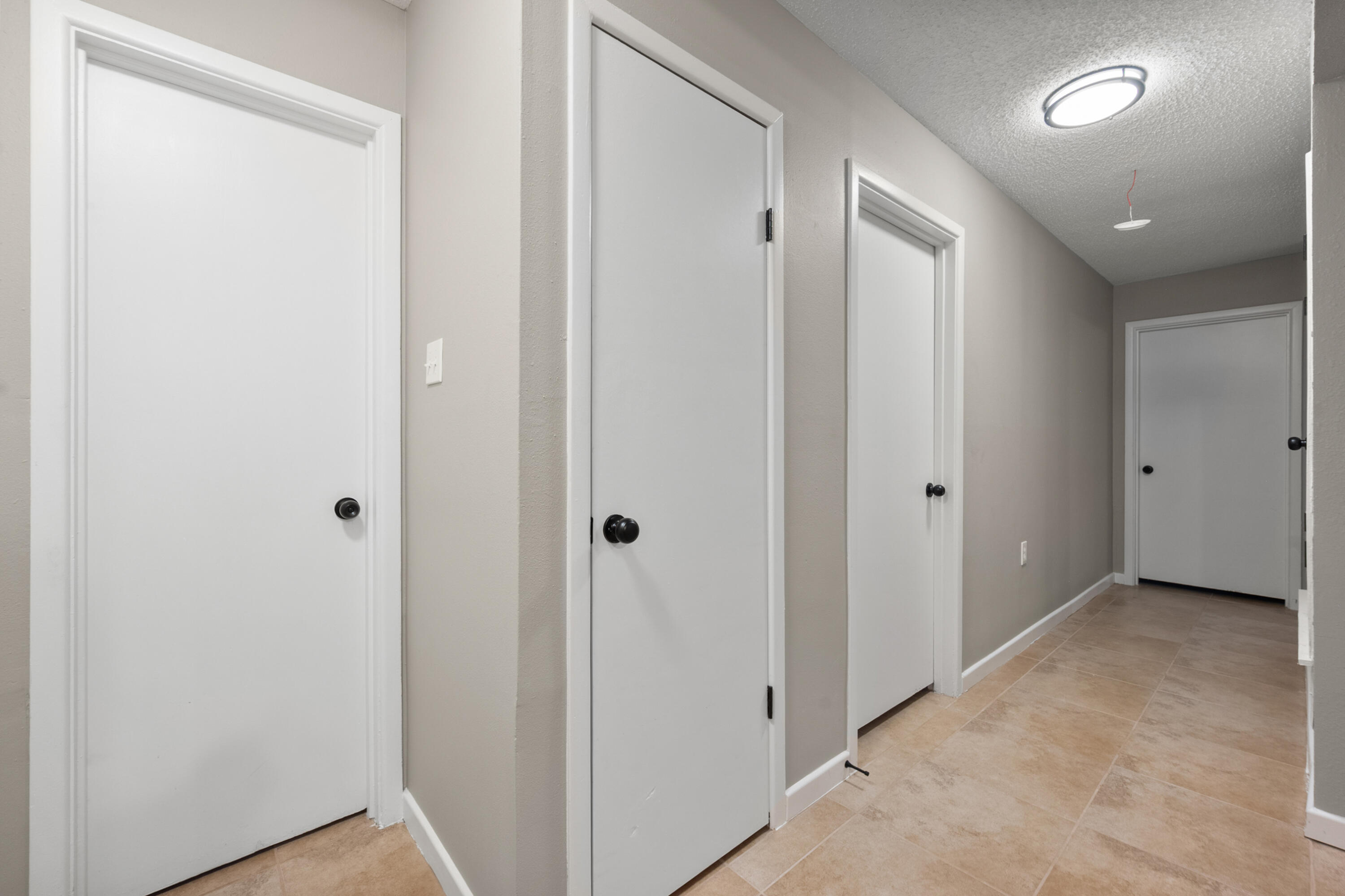 4915 11th Street Lubbock, TX 79416 - Photo 22 of 28 a view of hallway with closet area