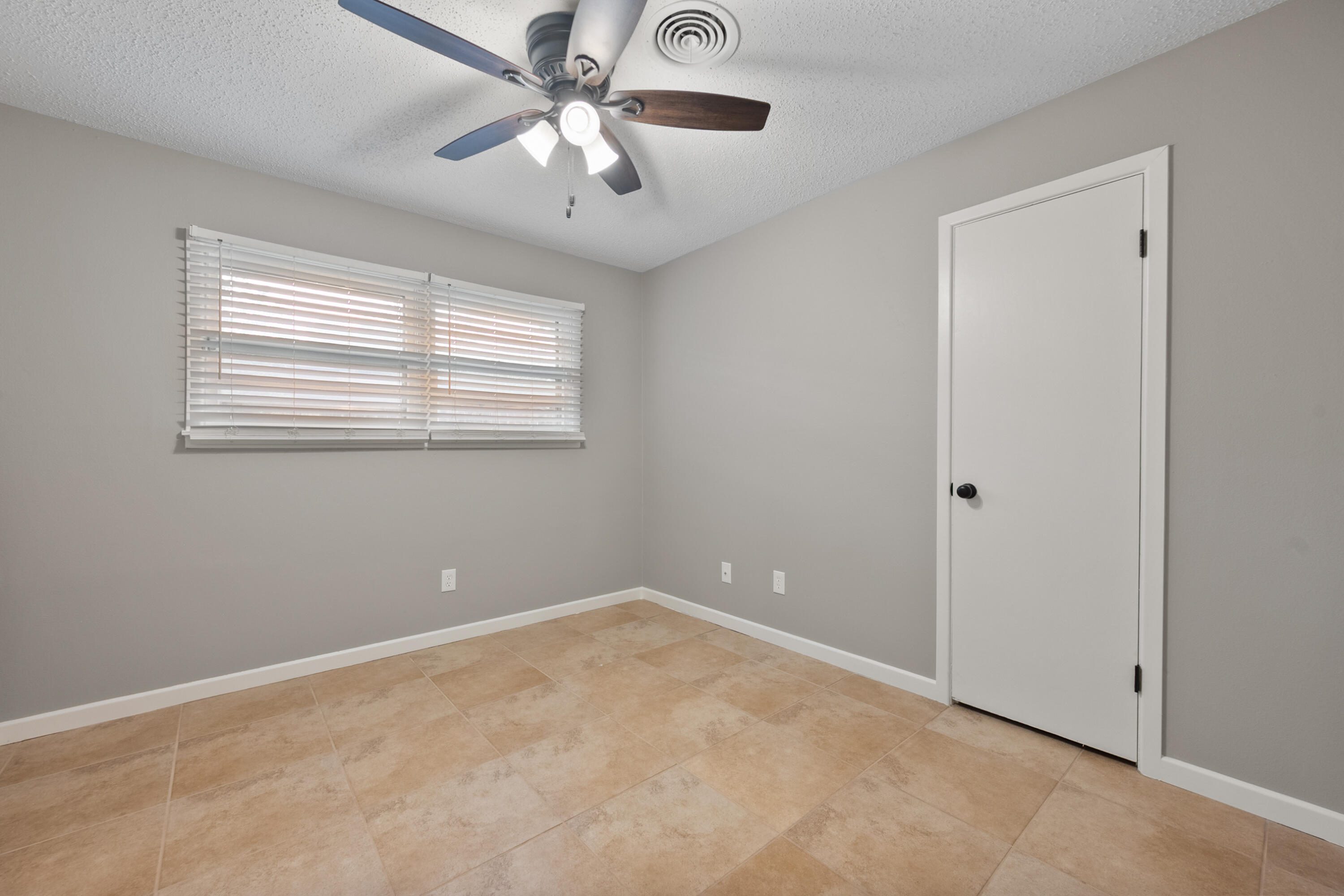 4915 11th Street Lubbock, TX 79416 - Photo 24 of 28 a view of an empty room with a window