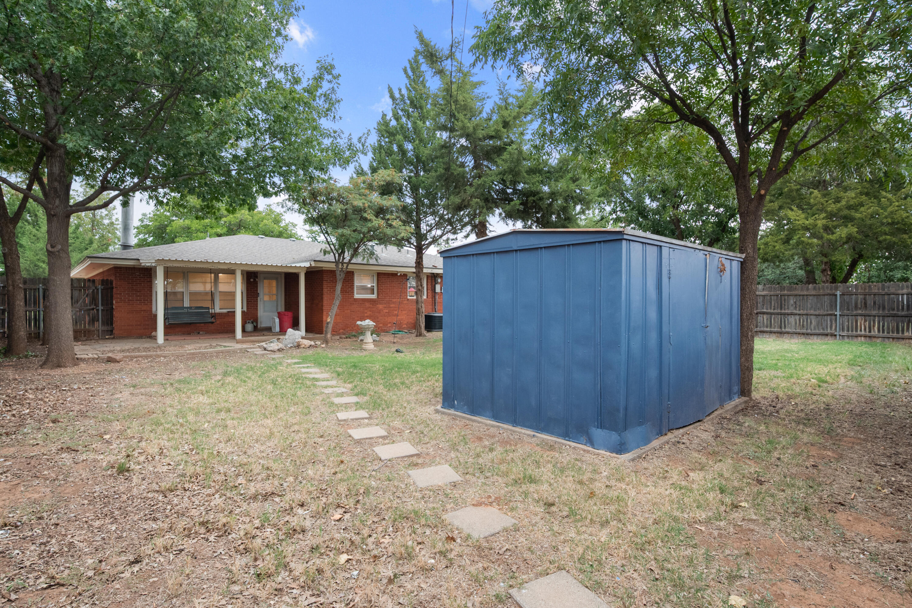 4915 11th Street Lubbock, TX 79416 - Photo 28 of 28 a front view of a house with a yard