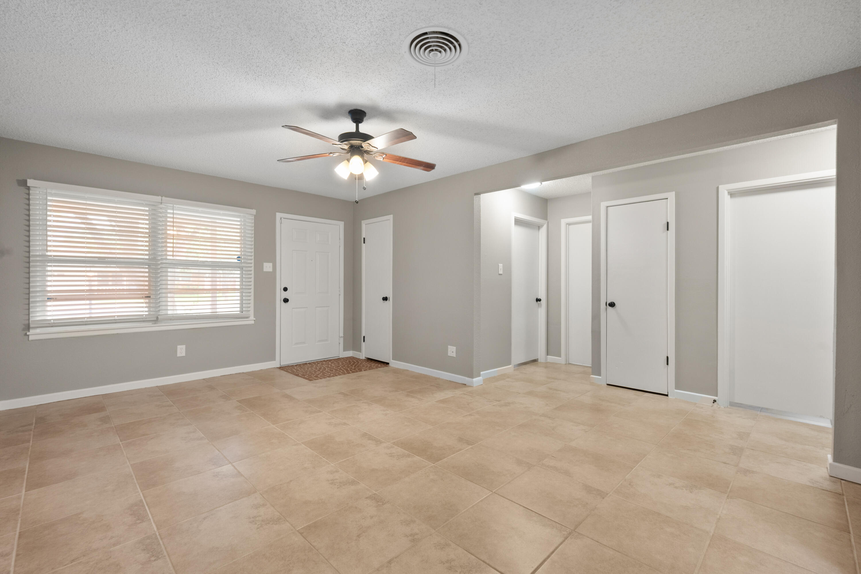 4915 11th Street Lubbock, TX 79416 - Photo 5 of 28 a view of an empty room with a window