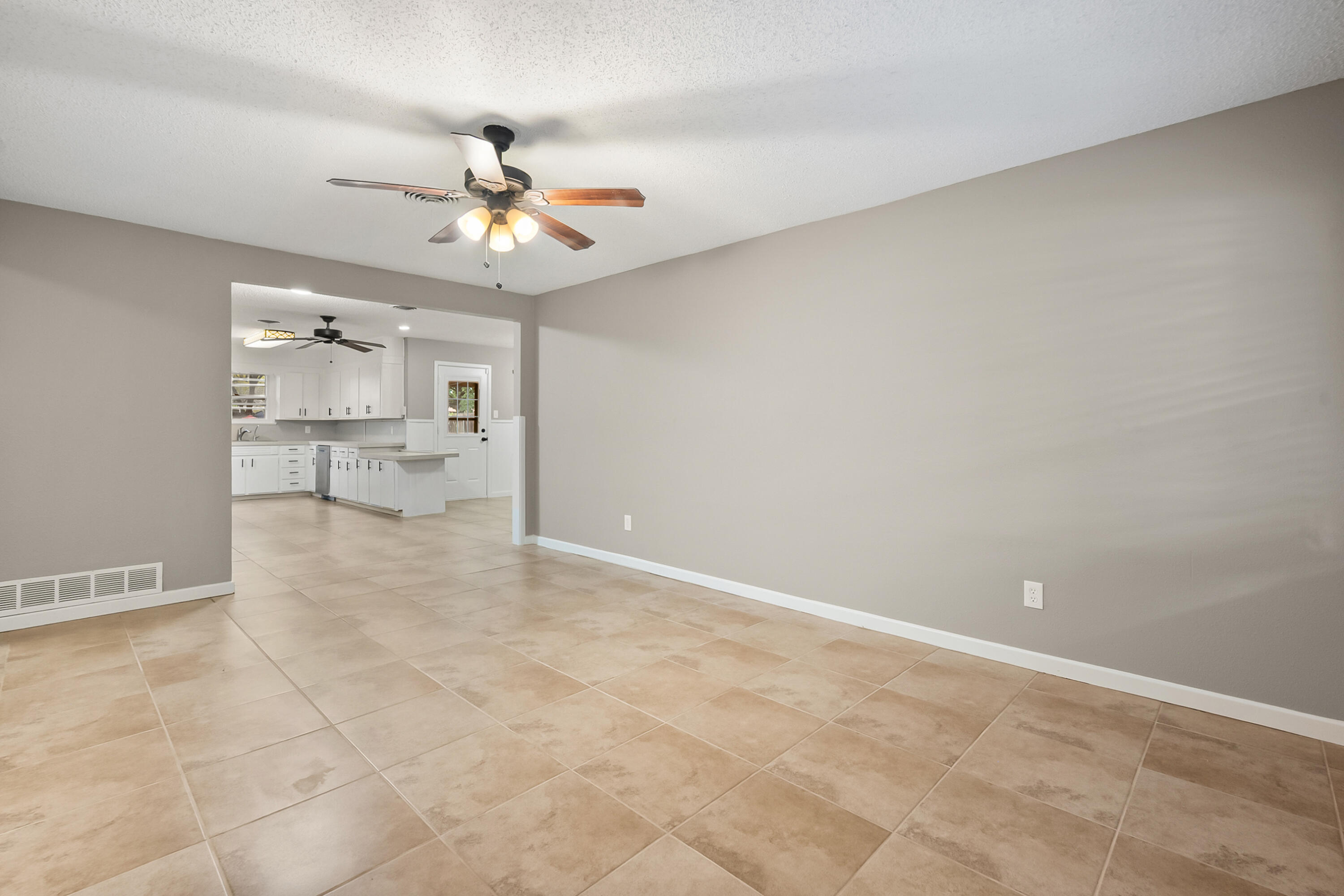 4915 11th Street Lubbock, TX 79416 - Photo 8 of 28 wooden floor in an empty room with a window