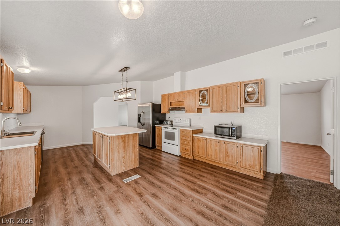 1890 West Dyer Road Pahrump, NV 89048 - Photo 36 of 40 This spacious kitchen offers a functional layout with ample cabinetry and modern amenities.