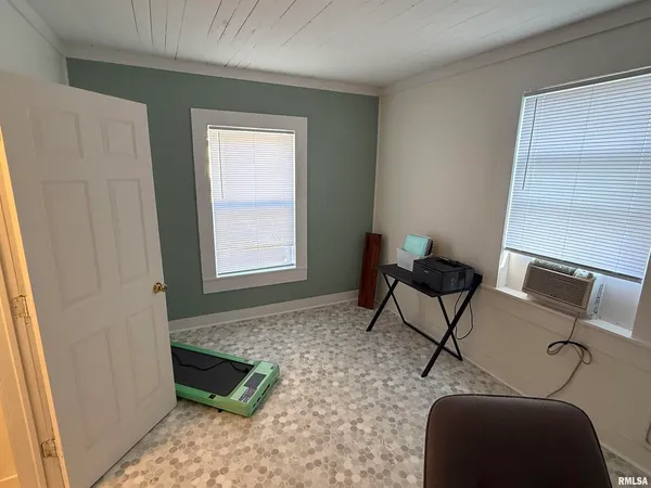 a bathroom with a shower and a sink
