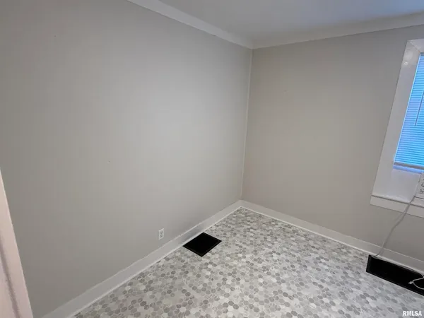 a spacious bedroom with a bed and a couch