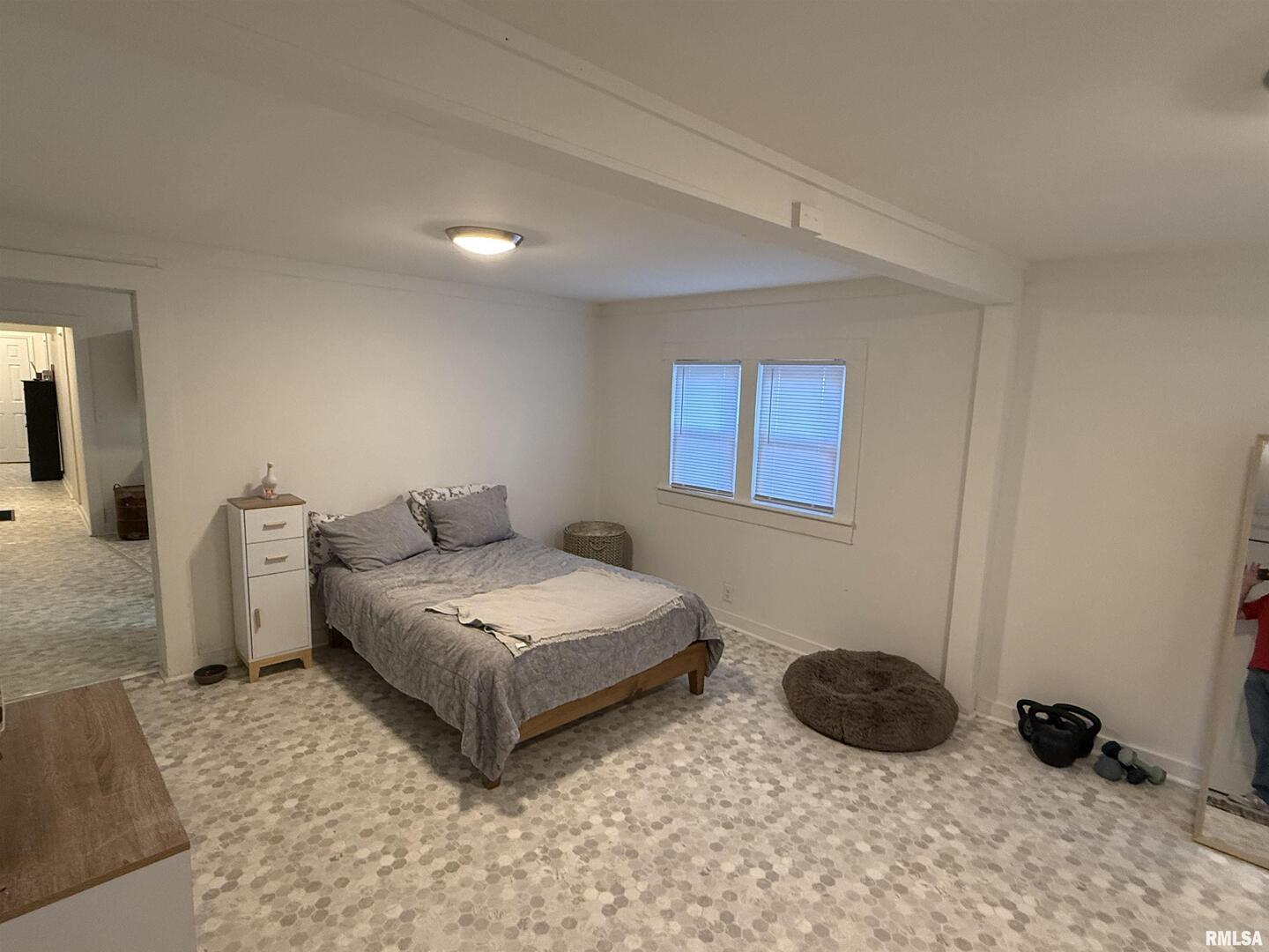 1100 Catherine Street Metropolis, IL 62960 - Photo 39 of 64 a spacious bedroom with a bed and a couch