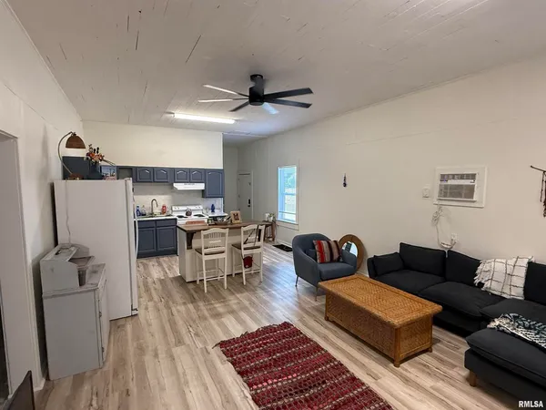 a kitchen with stainless steel appliances granite countertop a stove refrigerator and a sink