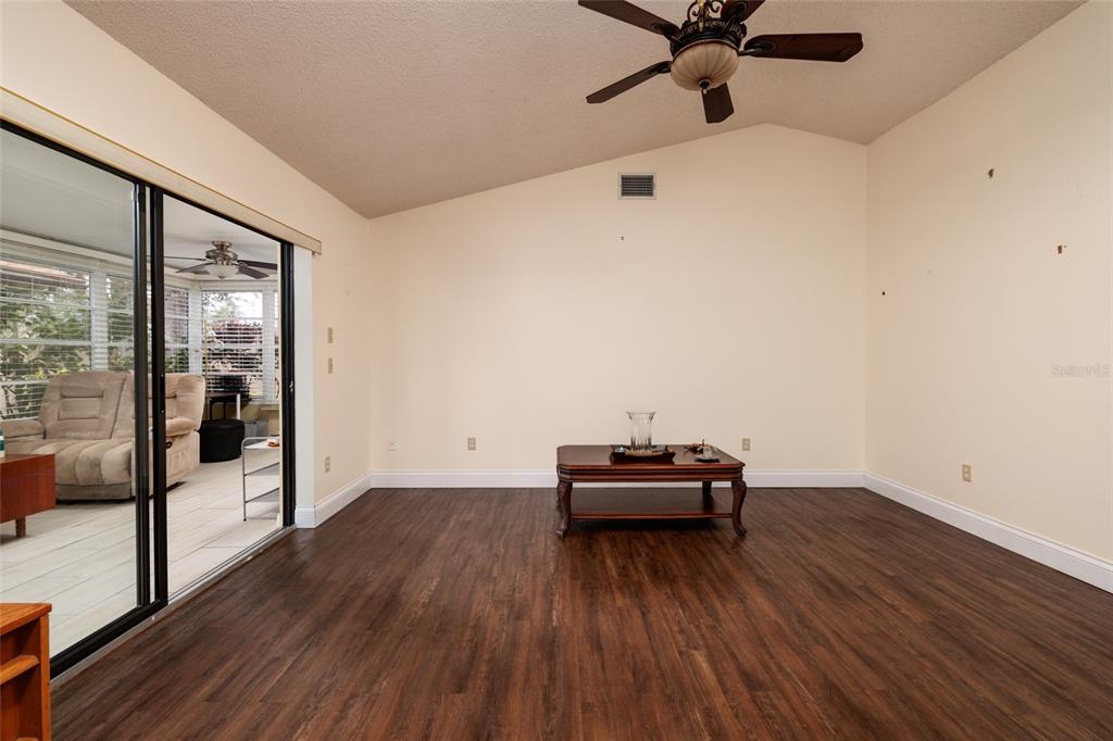 1696 Fry Court Dunedin, FL 34698 - Photo 9 of 30 a view of a livingroom with wooden floor
